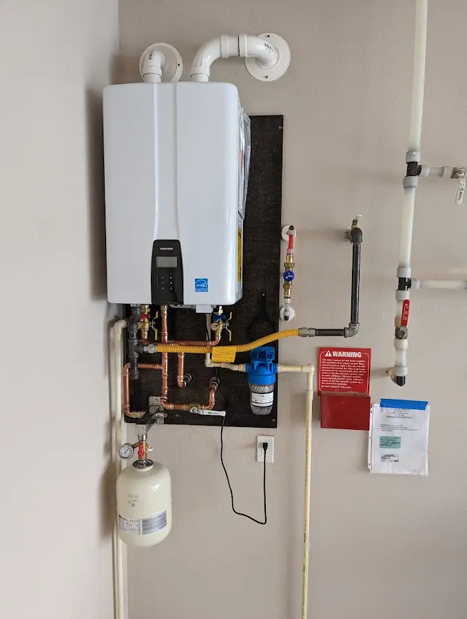 Professional plumber installing copper piping in a Northlake home