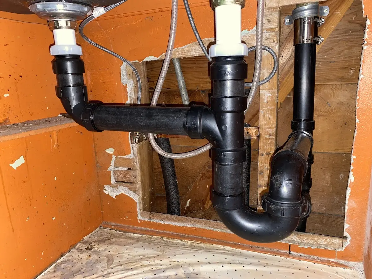 Professional Garbage Disposal Repair equipment and tools on the job in Northlake